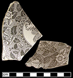 Saucer fragments printed in black (upper left) and brown (lower right).  Both sherds are biscuit fired and unglazed and most likely date to the 1820s-1830s - Collected by George L. Miller in 1986 in Hanley.  Cannot be attributed to a specific pottery.